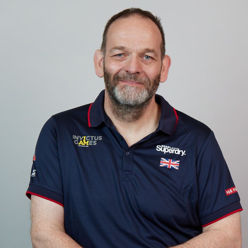 Paul sits in his Team UK Invictus Games kit